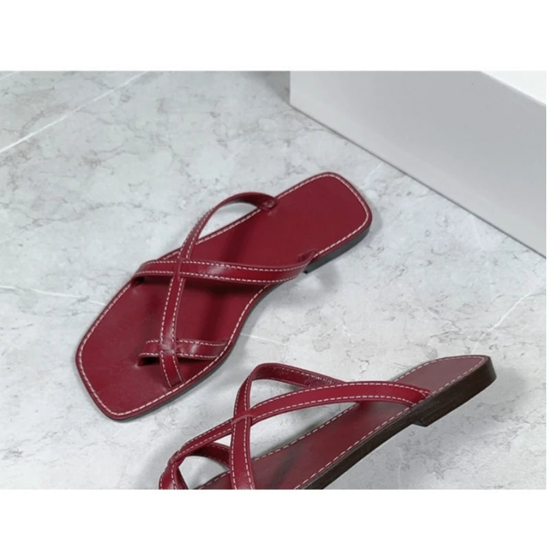 25 year niche women's genuine leather toe flip flops with retro cross straps and simple flat bottom sandals